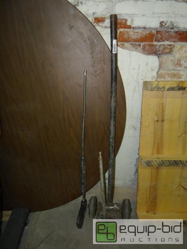 lot 1464 image: Barrel dolly and 2 power washer wands....