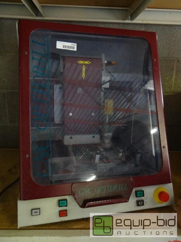 lot 1534 image: CNC Optidrill with housing case. Powers on....