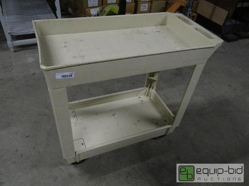 lot 1594 image: Plastic bus cart on wheels....