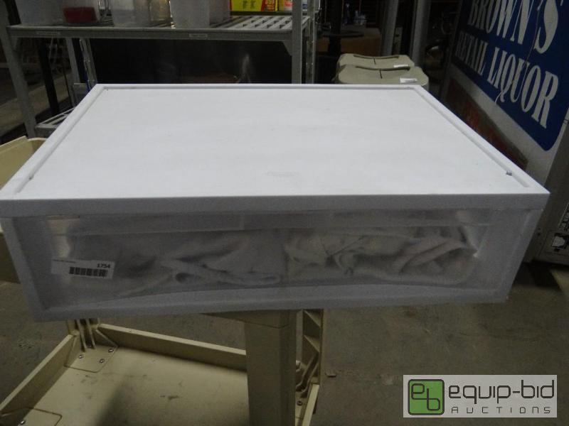 lot 1754 image: Plastic storage drawer with aprons....