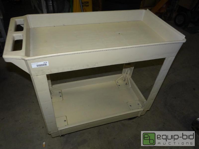 lot 1818 image: Plastic 2 shelf bus cart with wheels and hand...