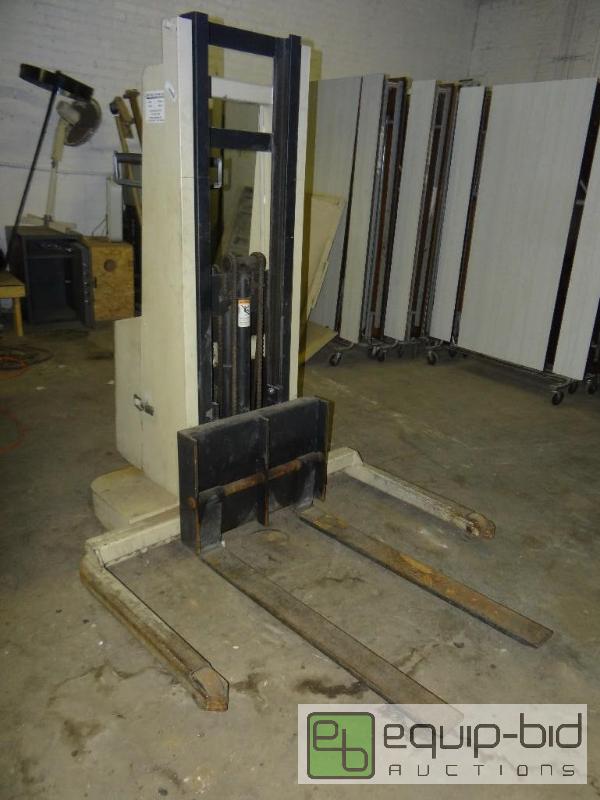 lot 1834 image: CROWN electric pallet stacker.  This has the ...
