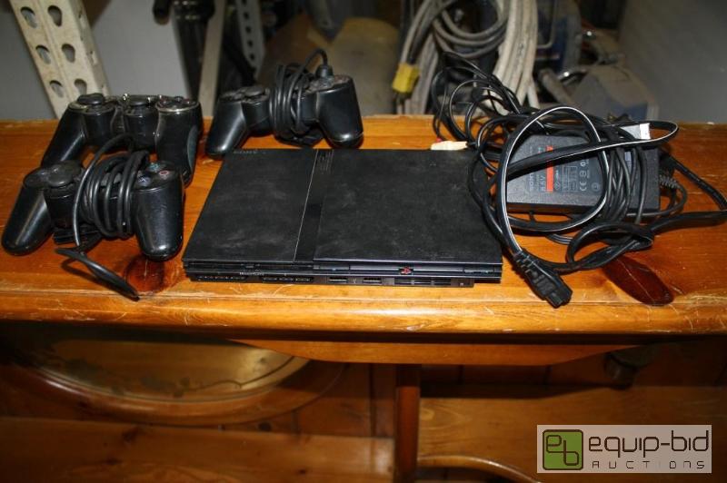 lot 121 image: PS2 with 3 remotes...