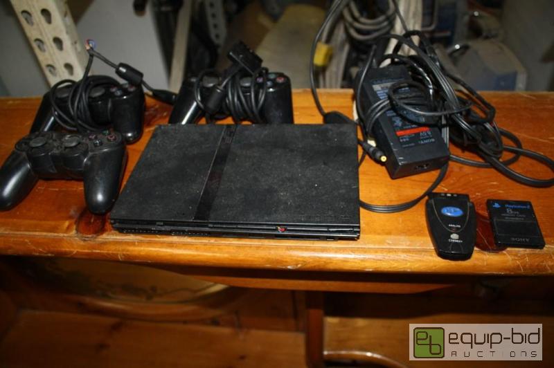 lot 122 image: PS2 with 3 remotes and 8 MB memory...