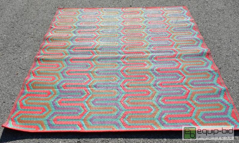 lot 5047 image: Colorful Outdoor Rug  This colorful plastic w...