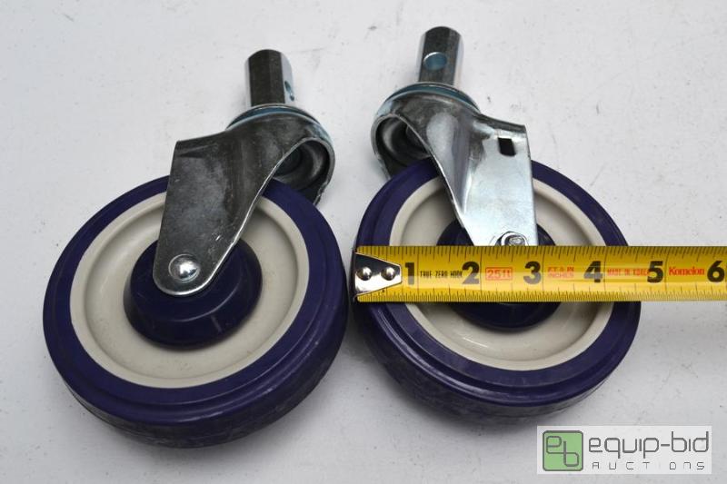 lot 5074 image: pair of large blue and white swivel casters...