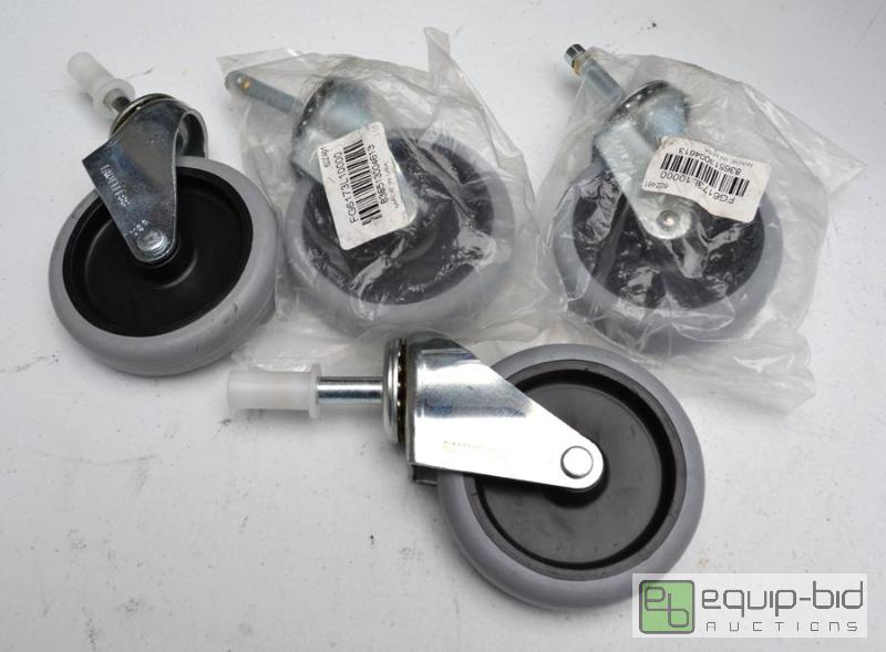 lot 5081 image: Set of 4 Faultless gray and black swivel cast...