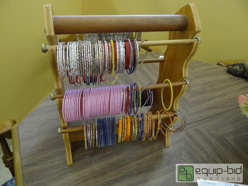 lot 241 image: WOODEN DISPLAY RACK, WITH 100S OF BRACELETS....