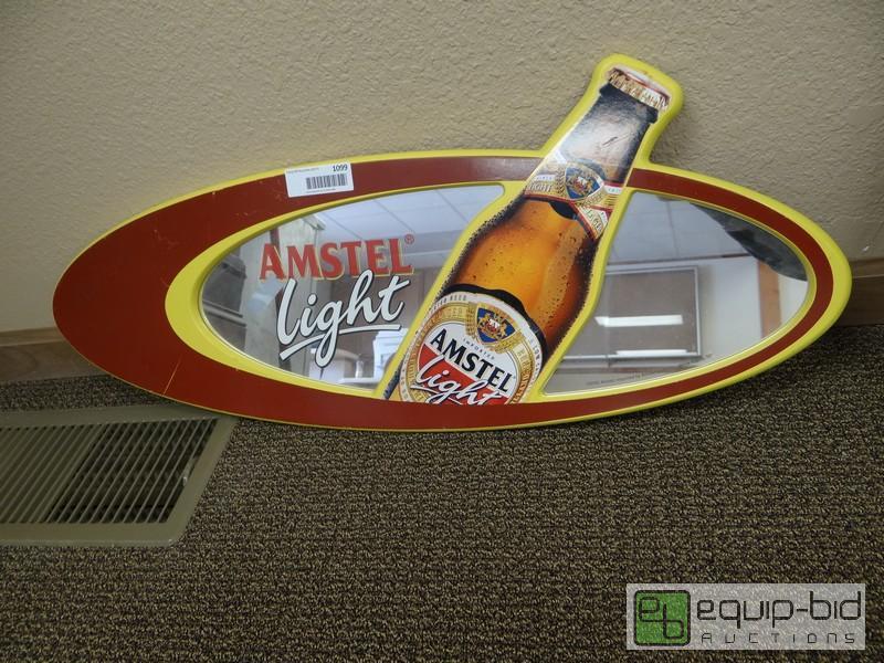 lot 1099 image: Oval Amstel Light Mirror  31x14...