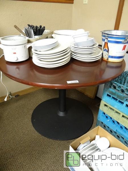 lot 1134 image: 48Inch Diameter Dark Wood Table With Heavy Ir...