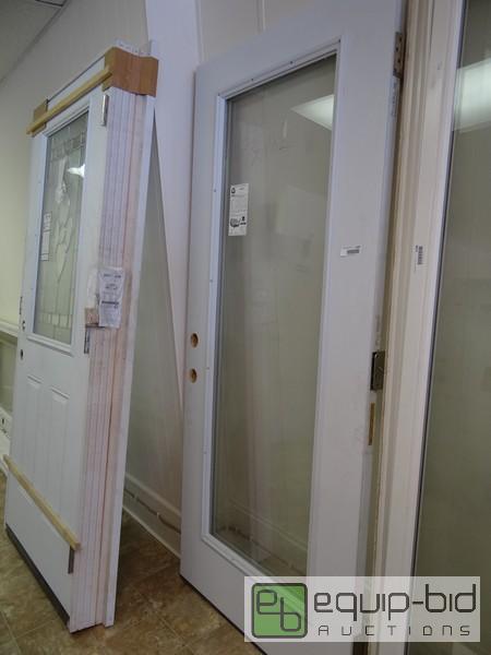 lot 1209 image: New Mid Am Glass Center Metal Sided Door  36x...
