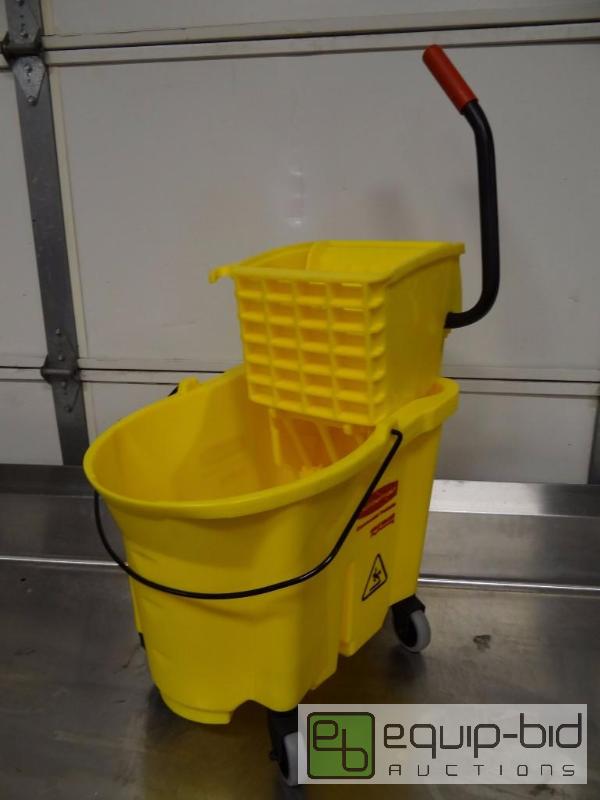 lot 1107 image: Brand New Rubbermaid Poly Mop Bucket On Caste...