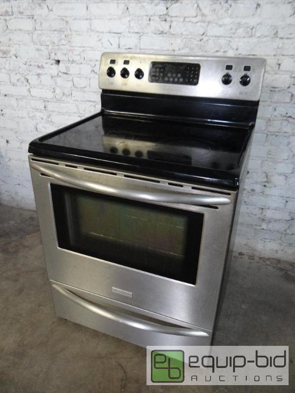 lot 1054 image: Frigidaire Professional Series Four Burner Glass Top Range and Convection Oven