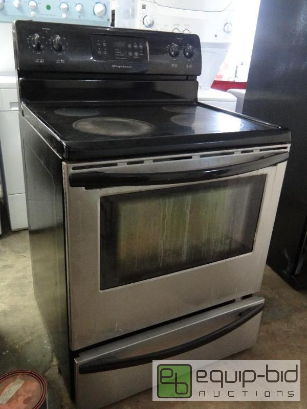 lot 62 image: Frigidair Four Burner Electric Glass Top Range and Oven