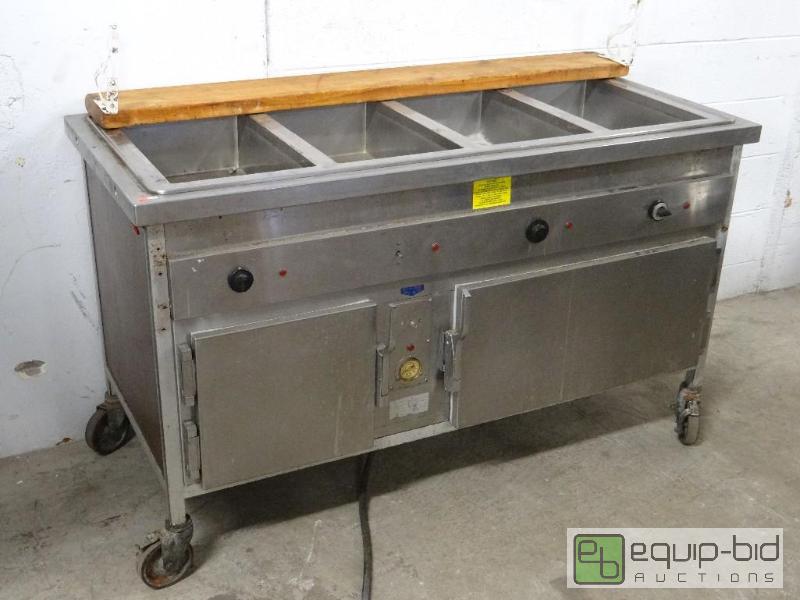 lot 1259 image: Set-N-Serve 4 Well Steam Table on Casters w Heated Under Cabinets