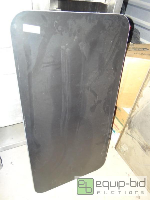 lot 100 image: Nice black table top with metal trim. 46&quot...