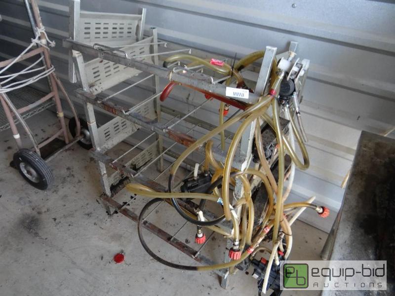 lot 111 image: Bag in the box rack with 9 pumps....