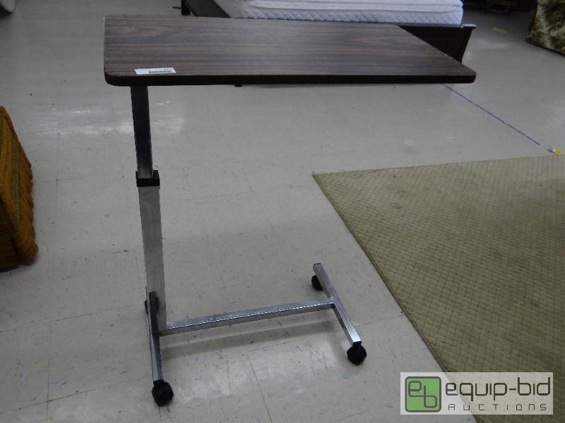 lot 2092 image: Adjustable bed tray on wheels....