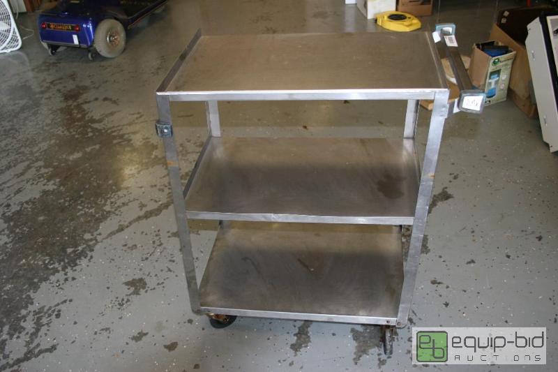 lot 1433 image: Stainless Steel rolling serving cart. 2x15.5...