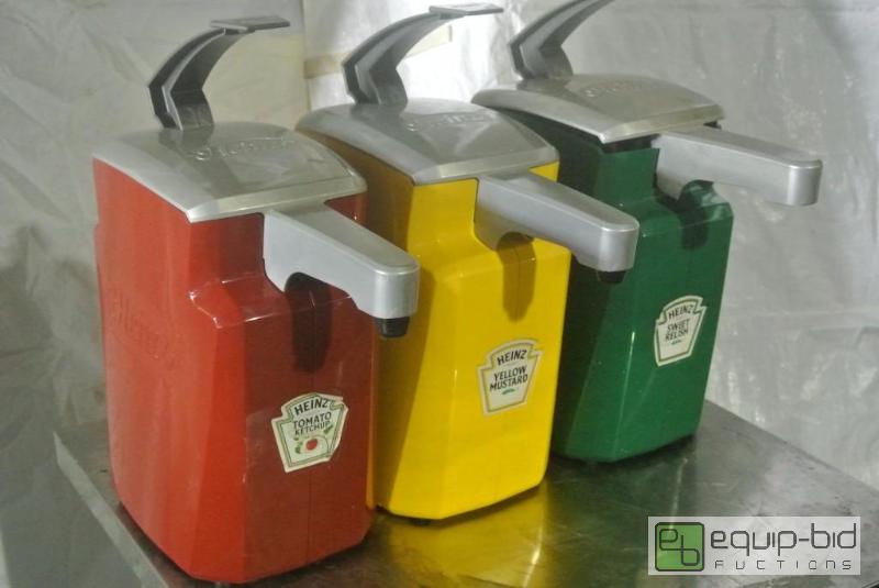 lot 634 image: (3) Condiment Pumps