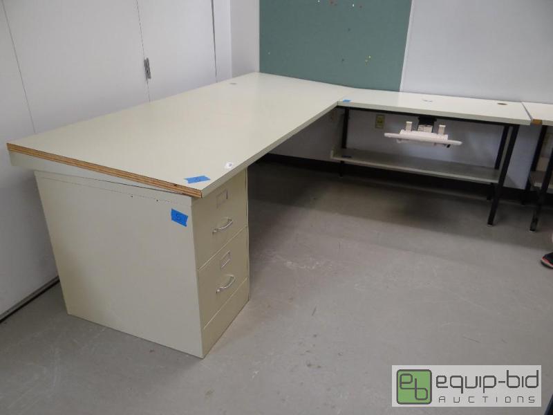 lot 101 image: Large L shape desk with slant top on one side...