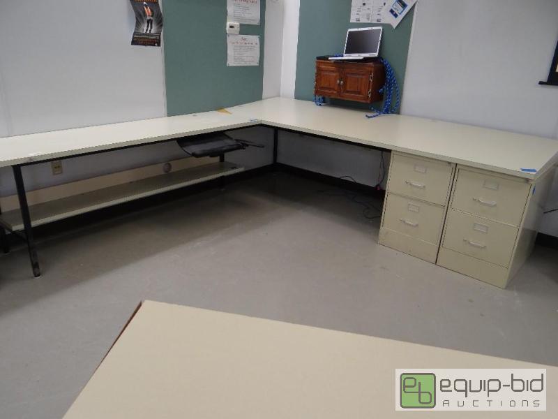 lot 102 image: Large L shape desk with slant top on one side...