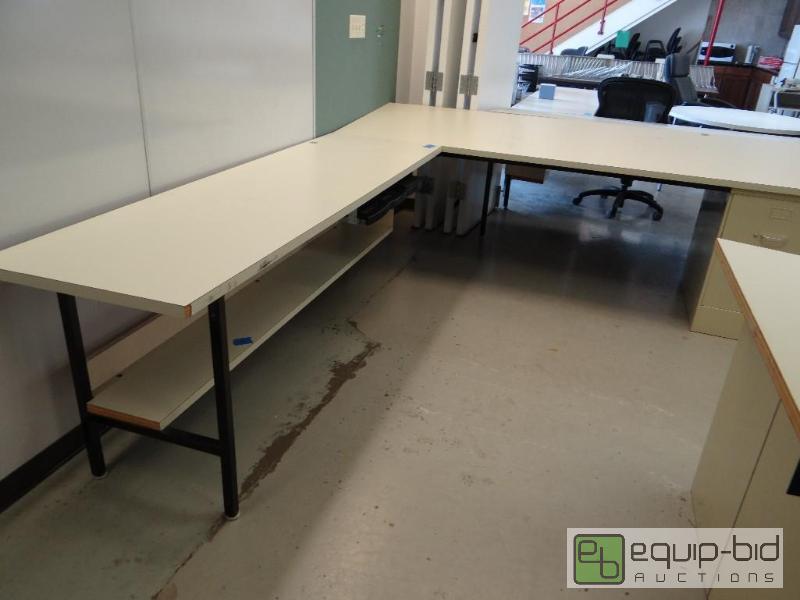 lot 104 image: Large L shape desk with slant top on one side...