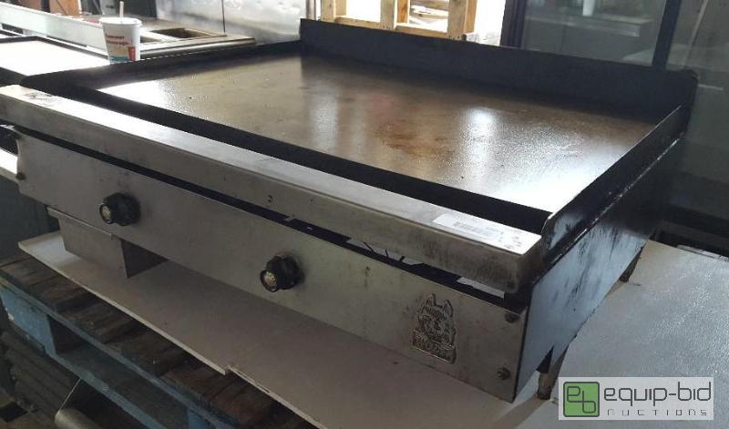 lot 1005 image: Wolf natural gas flat top grill  Thermostatic...