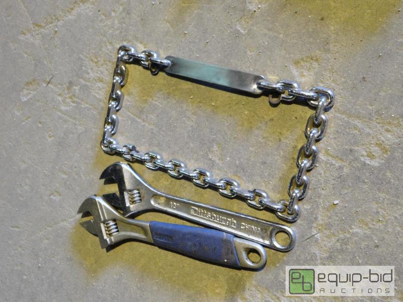 lot 567 image: License Plate Frame w Cresent Wrenches