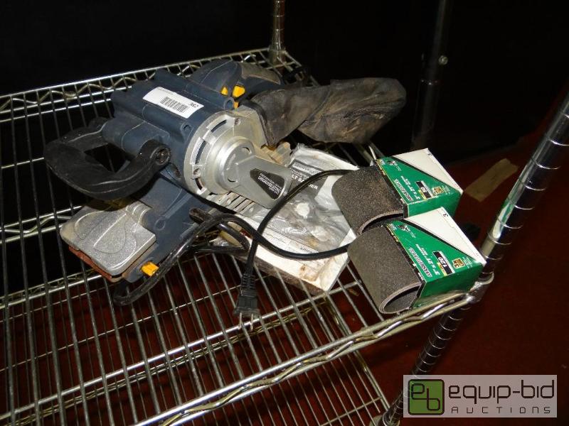 lot 382 image: Belt sander with 2 extra sand belts....