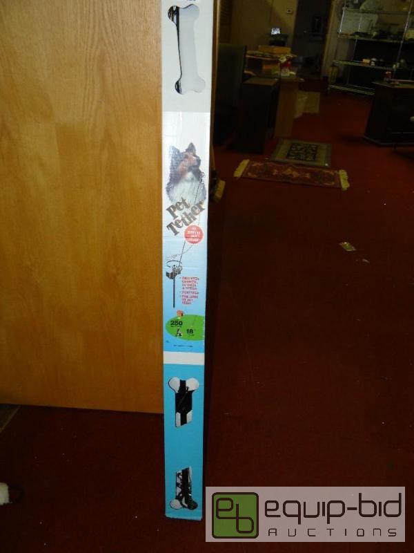 lot 401 image: New in box dog tether....