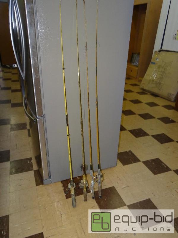 lot 467 image: Lot of 4 old fishing poles with reels....
