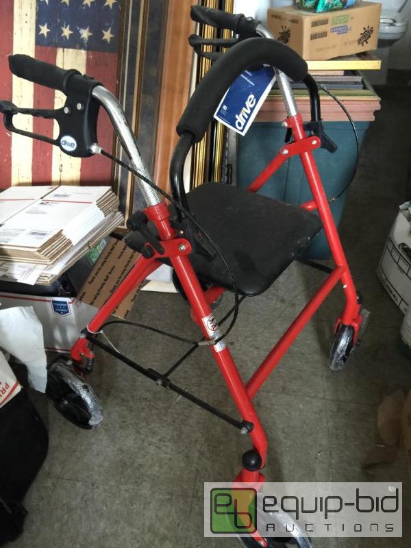 lot 142 image: New walker with fold-down seat and handbrakes...