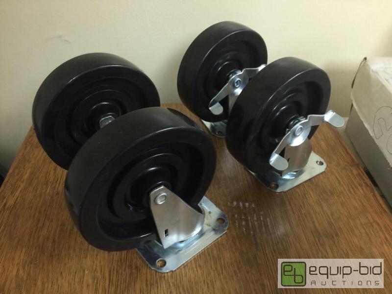 lot 33 image: New set of 5 inch casters two wheels have bre...