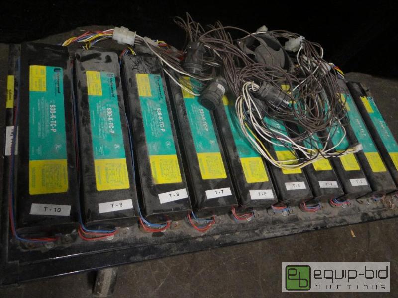 lot 7330 image: (10) Universal Lighting Ind. Power Cell 1500MA Rappid Start Ballast on a Rack