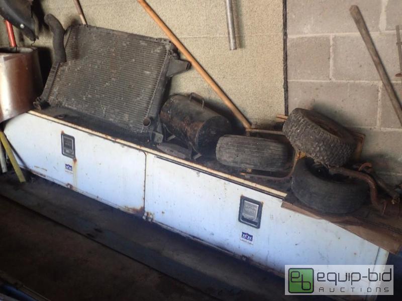 lot 799 image: Metal TruckVan Storage Box w Misc Tires and Radiator