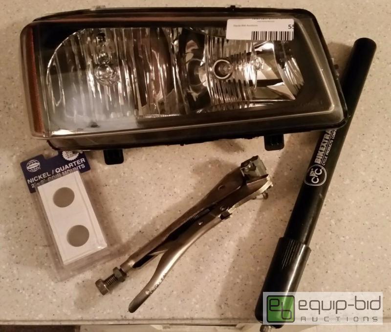 lot 16 image: Fram Air filter, silverado headlight assembly and other new items.