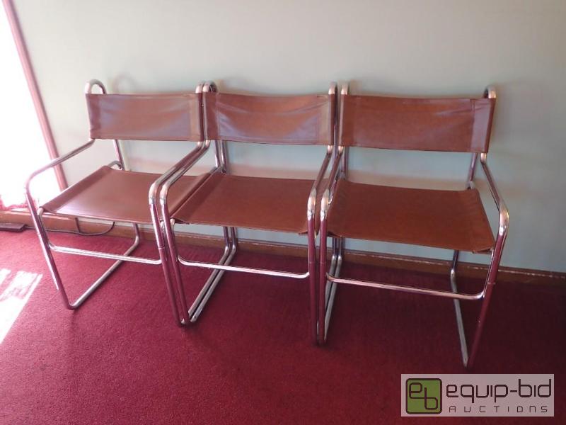 lot 596 image: (3) brown vinal padded metal framed chairs