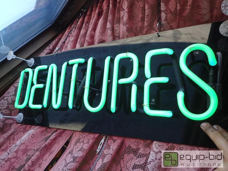 lot 602 image: lighted dentures neon display