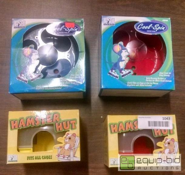 lot 1043 image: 2 hamster hut and 2 hamster spinning wheels...