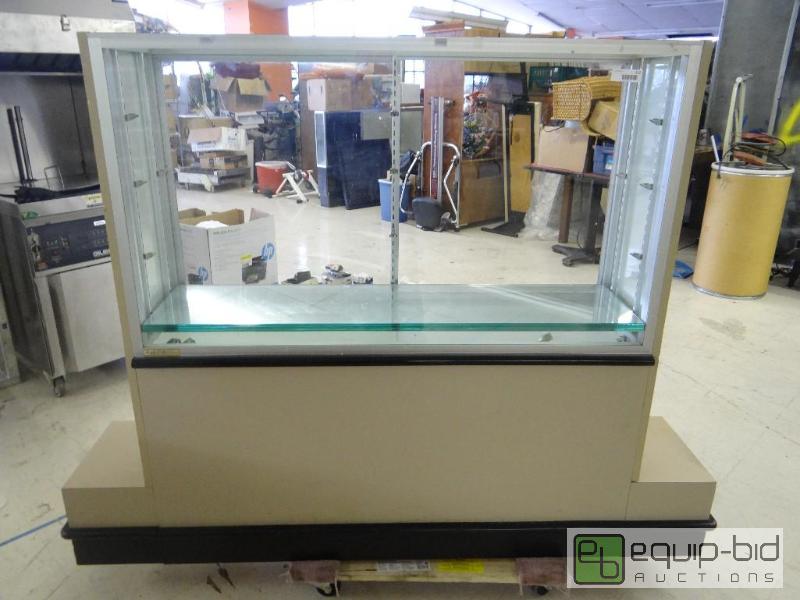 lot 112 image: Showcase with glass shelves and slat wall sid...
