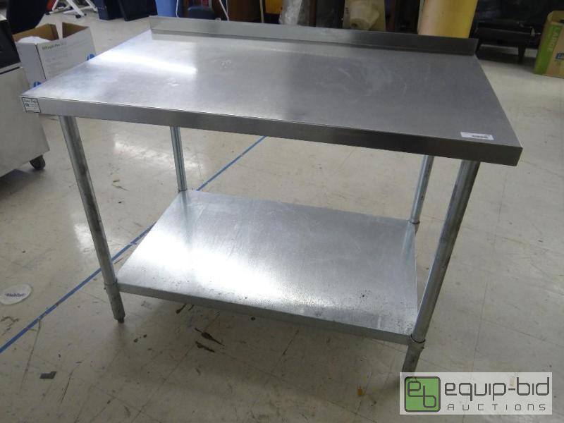 lot 113 image: Stainless steel table with back splash and un...