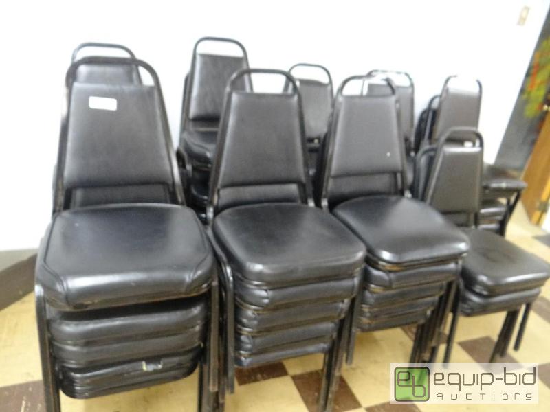 lot 125 image: Lot of 43 black padded stack chairs....
