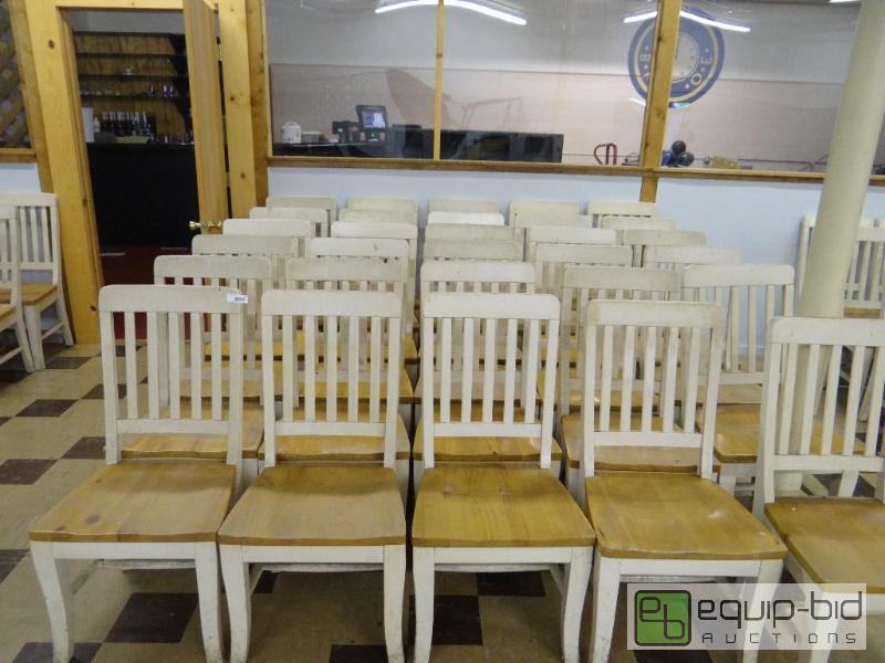 lot 127 image: Lot of 30 matching solid wood dining chairs. ...