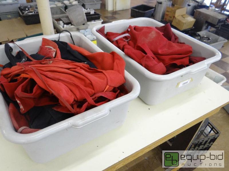 lot 173 image: 2 bus tubs full of aprons....