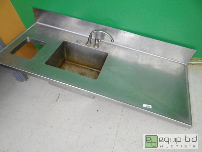lot 238 image: Stainless steel sink with faucet. No legs....