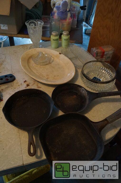 lot 8076 image: Group includes Several Cast Iron Skillets, Jadite S&P, Juicer, Glassware and more