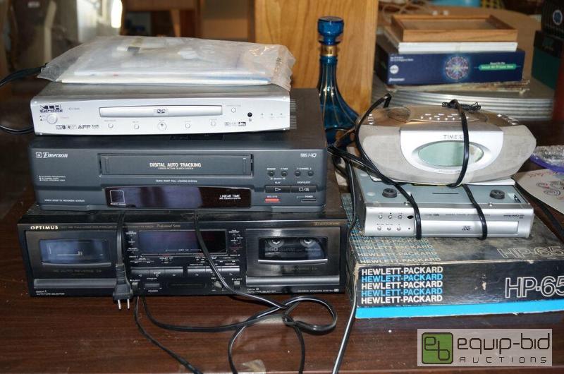 lot 8117 image: Large Group of Electronics - DVD players, VHS & Casette players, Stereo, Alarm Clock set, HP 65
