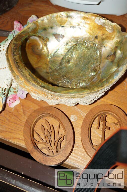 lot 814 image: Group includes Huge Abalone Shell, Dollies, Lazer Cut Wood Art Plaques,