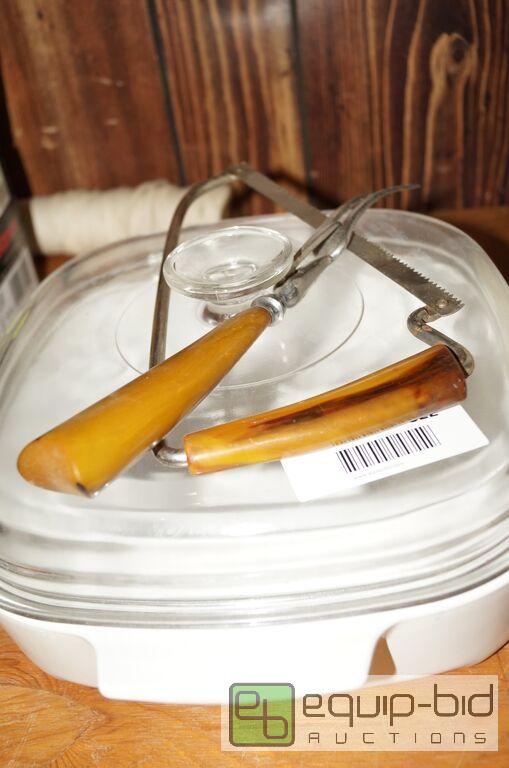 lot 822 image: Butterscotch Bakelite Handled Bone Saw & Meat Graber Plus Lidded Cassarole